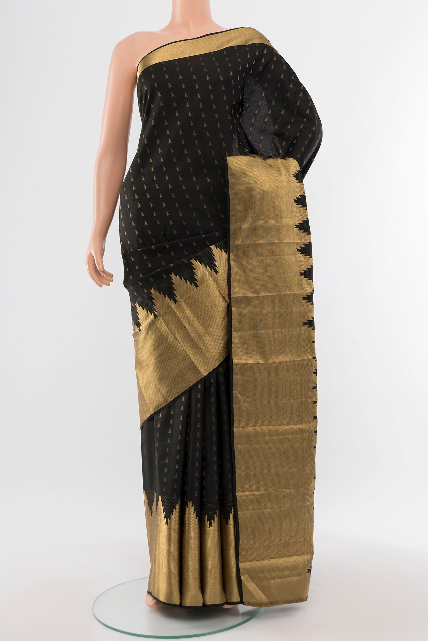 Pure Silk Pure Zari Black Kanchipuram Saree with Zari Butta on the body and Silk Border.  displayed on a mannequin