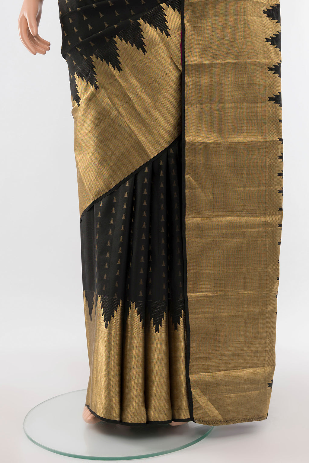 Pleats and pallu of Pure Silk Pure Zari Black Kanchipuram Saree with Zari Butta on the body and Silk Border. 