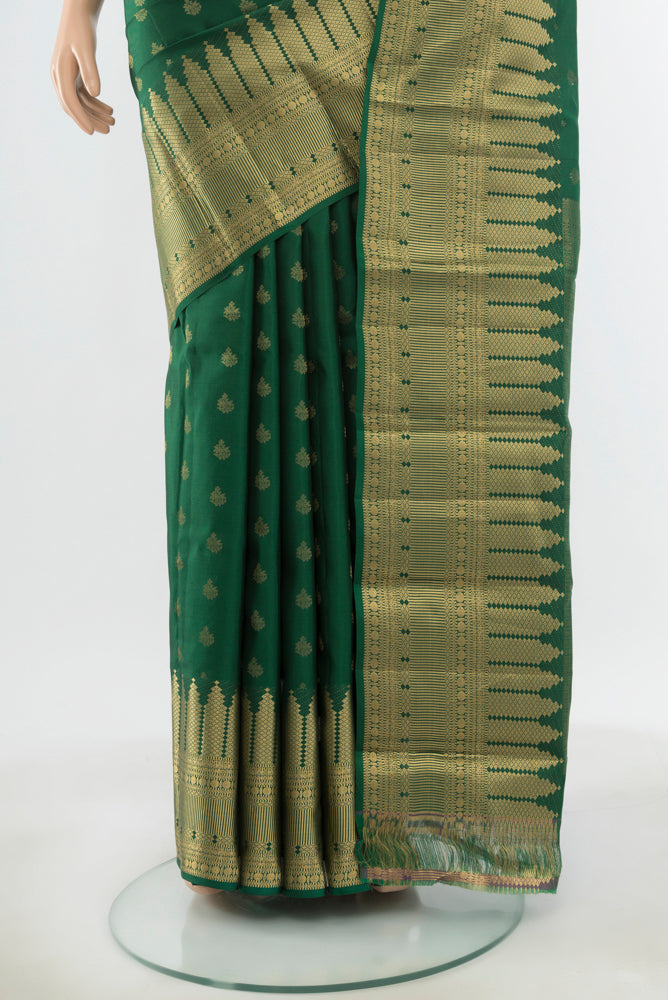 Pleats and pallu of Pure Silk Pure Zari Mint Green Kanchipuram Saree with Zari Butta on the body and Silk Border. 