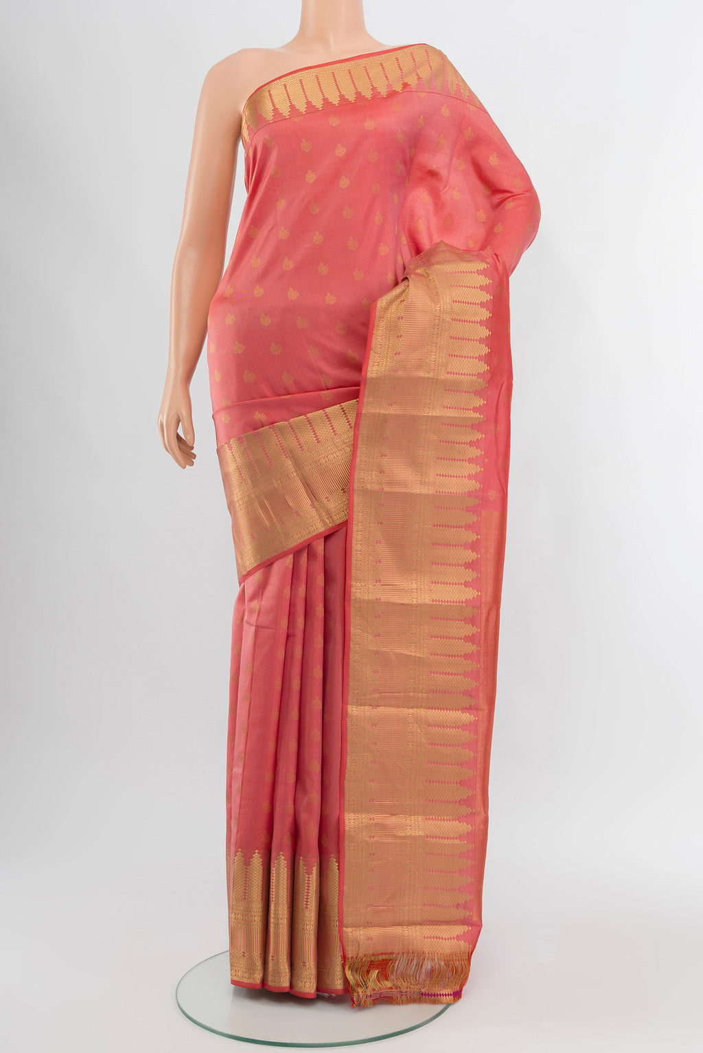 Coral Kanchipuram Silk Saree with Zari Butta on the body and Zari Border.  displayed on a mannequin