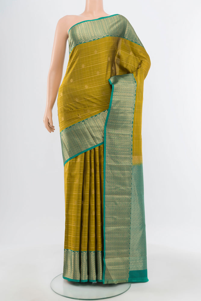Pure Silk Pure Zari Mehandi Green Kanjivaram Saree with Zari Brocade on the body and Silk Border.  displayed on a mannequin