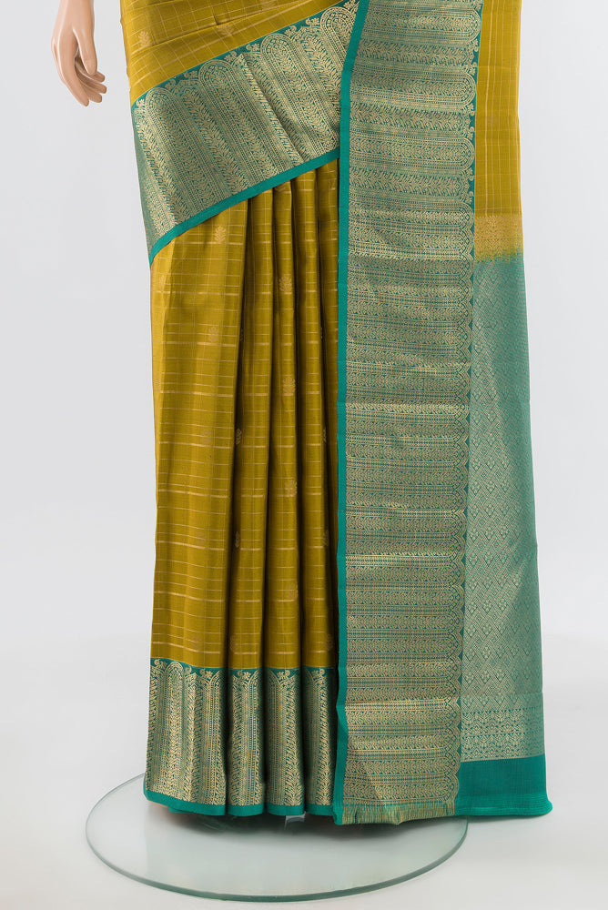 Pleats and pallu of Pure Silk Pure Zari Mehandi Green Kanjivaram Saree with Zari Brocade on the body and Silk Border. 