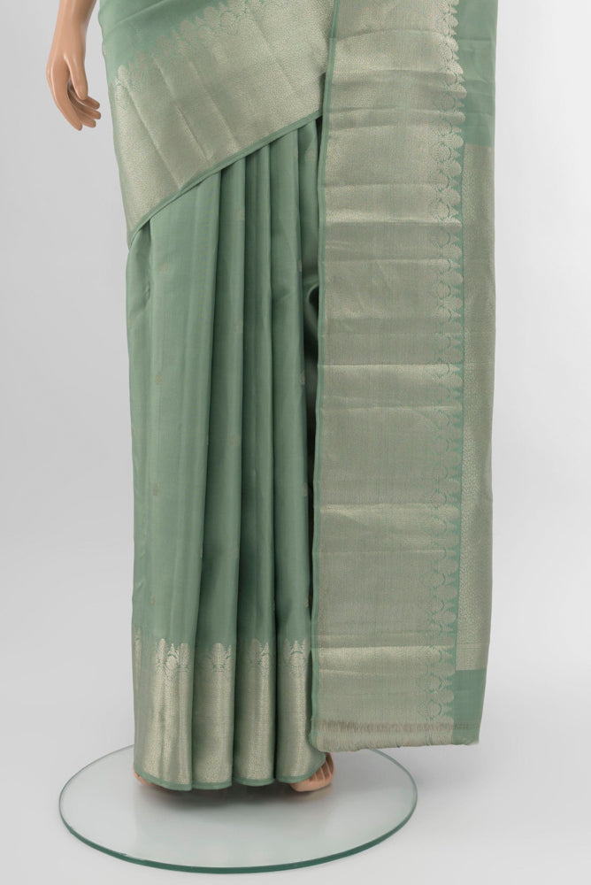 Pleats and pallu of Olive Green Kanchipuram Silk Saree with Zari Brocade on the body and Silk Border. 