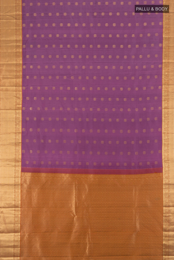 Flat view of Bronze Kanchipuram Silk Saree with Zari Butta on the body and Silk Border. 