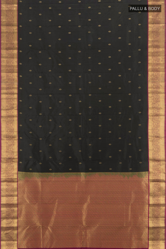 Flat view of Black Kanchipuram Silk Saree with Zari Butta on the body and Silk Border. 