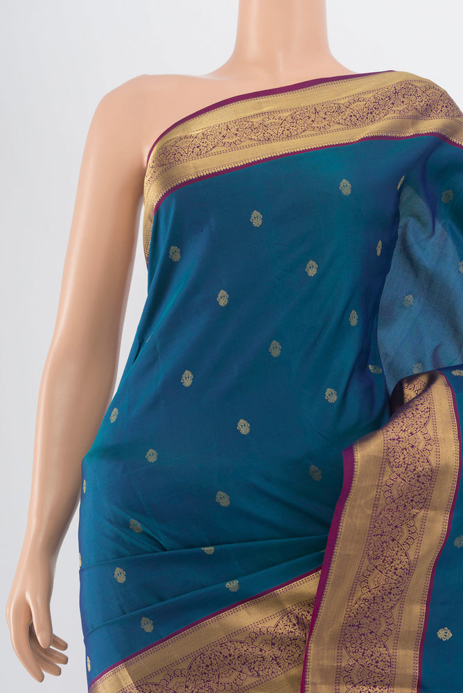 Border image of Peacock Blue Kanchipuram Silk Saree with Zari Butta on the body and Silk Border. 