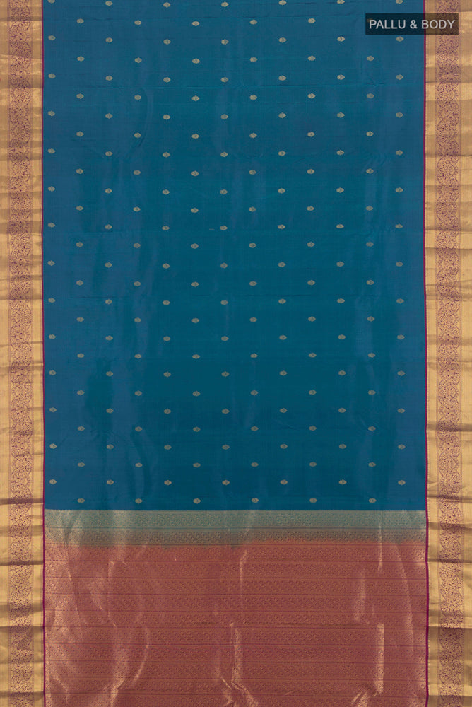 Flat view of Peacock Blue Kanchipuram Silk Saree with Zari Butta on the body and Silk Border. 