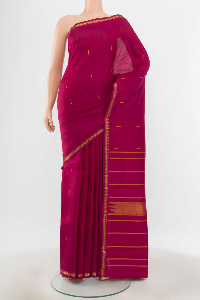 Pure Silk Pure Zari Maroon Kanchipuram Saree with Zari Butta on the body and Silk Border.  displayed on a mannequin