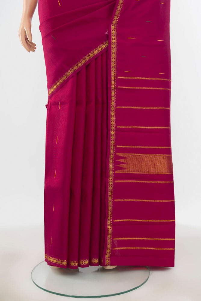 Pleats and pallu of Pure Silk Pure Zari Maroon Kanchipuram Saree with Zari Butta on the body and Silk Border. 