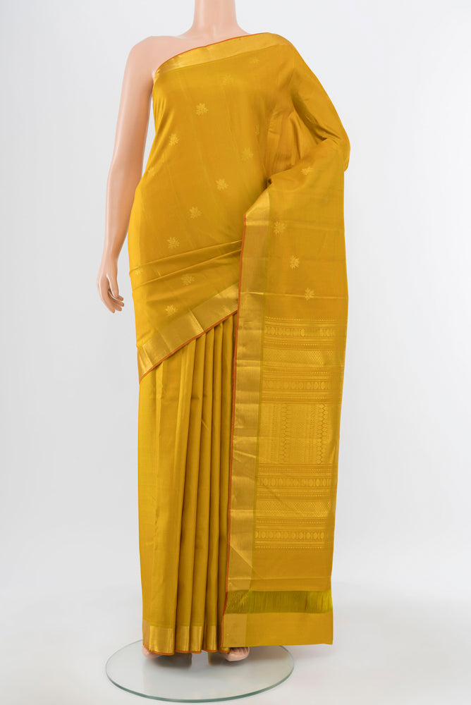 Pure Silk Pure Zari Mustard Kanjivaram Saree with Zari Brocade on the body and Silk Border.  displayed on a mannequin