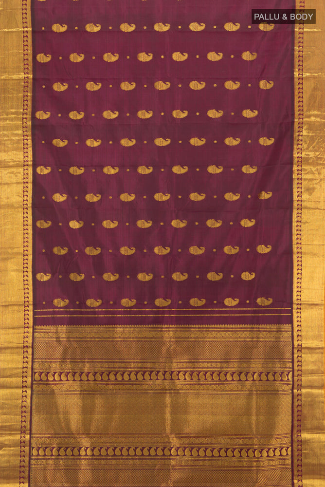 Flat view of Pure Silk Pure Zari Maroon Kanjivaram Saree with Zari Butta on the body and Silk Border. 