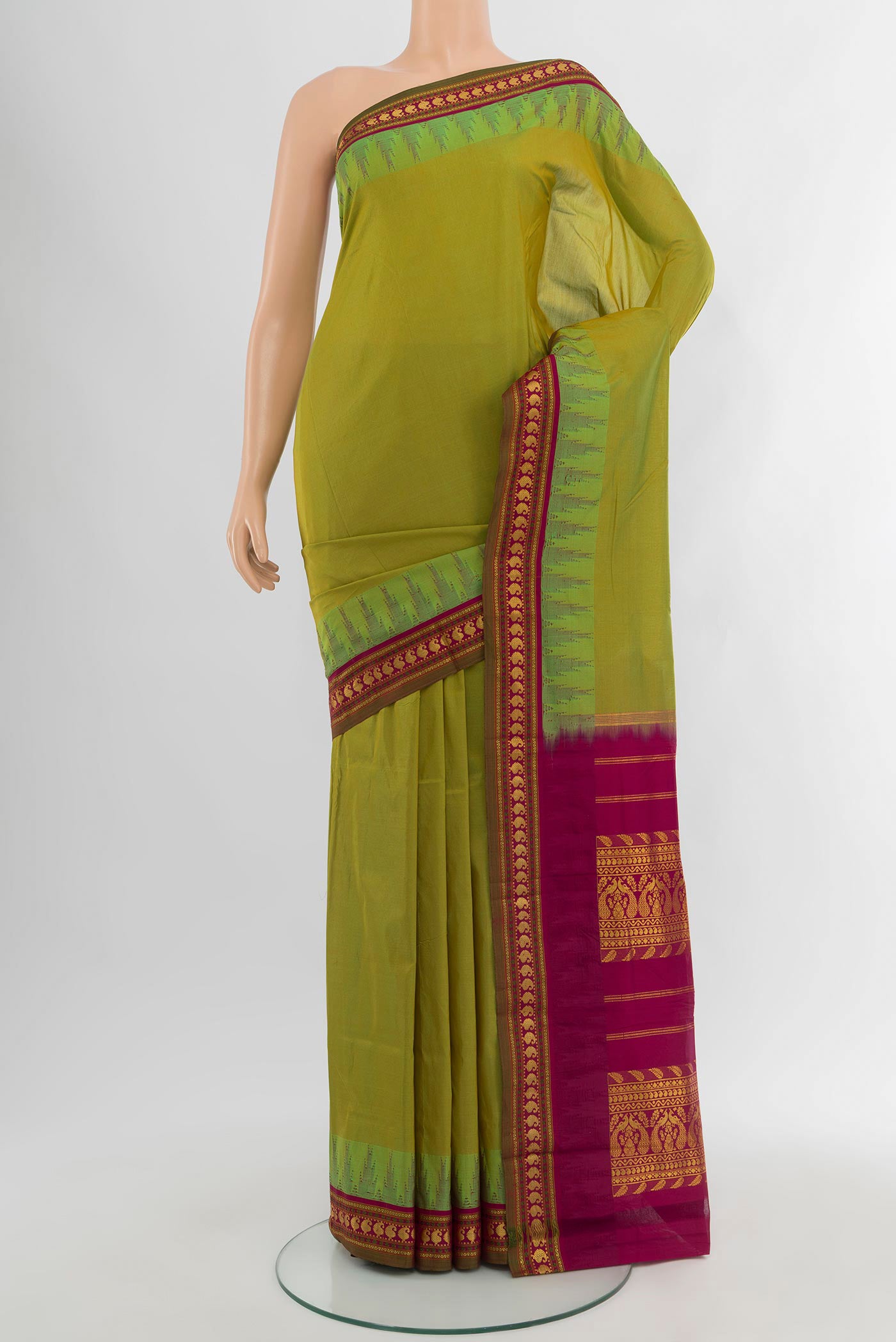 Green Bangalore Silk - kadyal Saree with Plain Body and Zari Border.  displayed on a mannequin