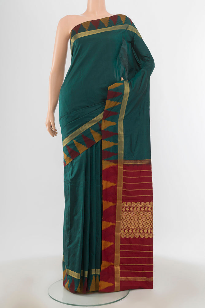 Peacock Blue Bangalore Silk - kadyal Saree with Zari Butta on the body and Silk Border.  displayed on a mannequin