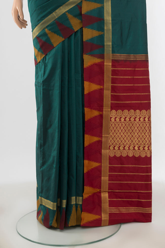 Pleats and pallu of Peacock Blue Bangalore Silk - kadyal Saree with Zari Butta on the body and Silk Border. 