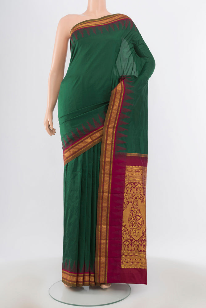 Pure Silk Pure Zari Bottle Green Bangalore - kadyal Saree with Zari Butta on the body and Silk Border.  displayed on a mannequin