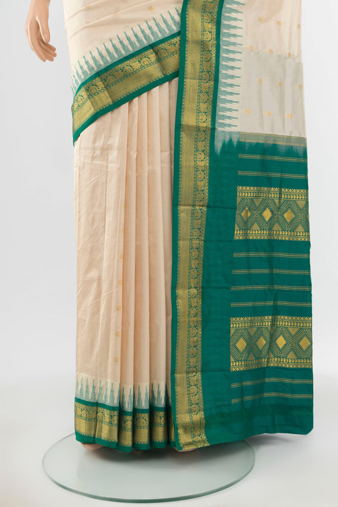Pleats and pallu of Pure Silk Pure Zari Cream Bangalore - kadyal Saree with Zari Butta on the body and Silk Border. 