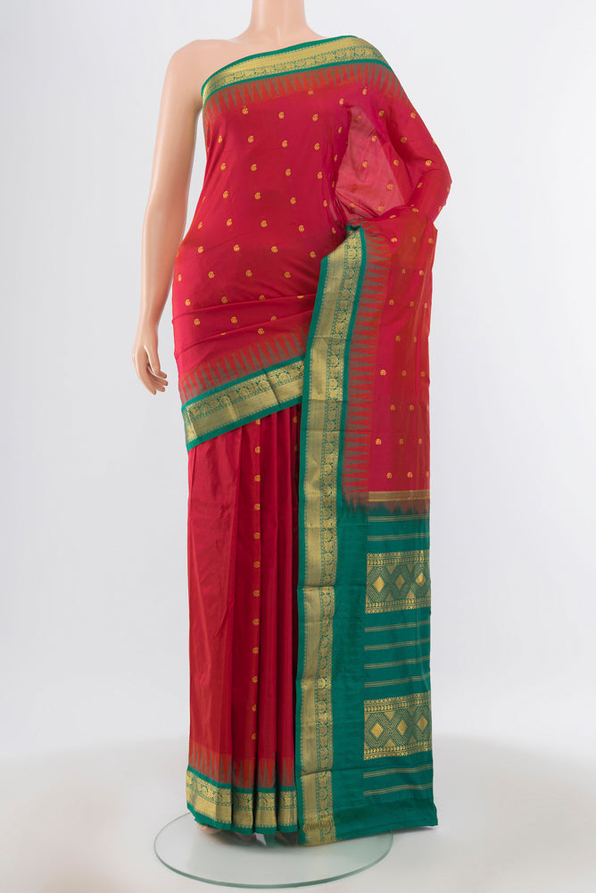 Pure Silk Pure Zari Peach Bangalore - kadyal Saree with Zari Butta on the body and Silk Border.  displayed on a mannequin