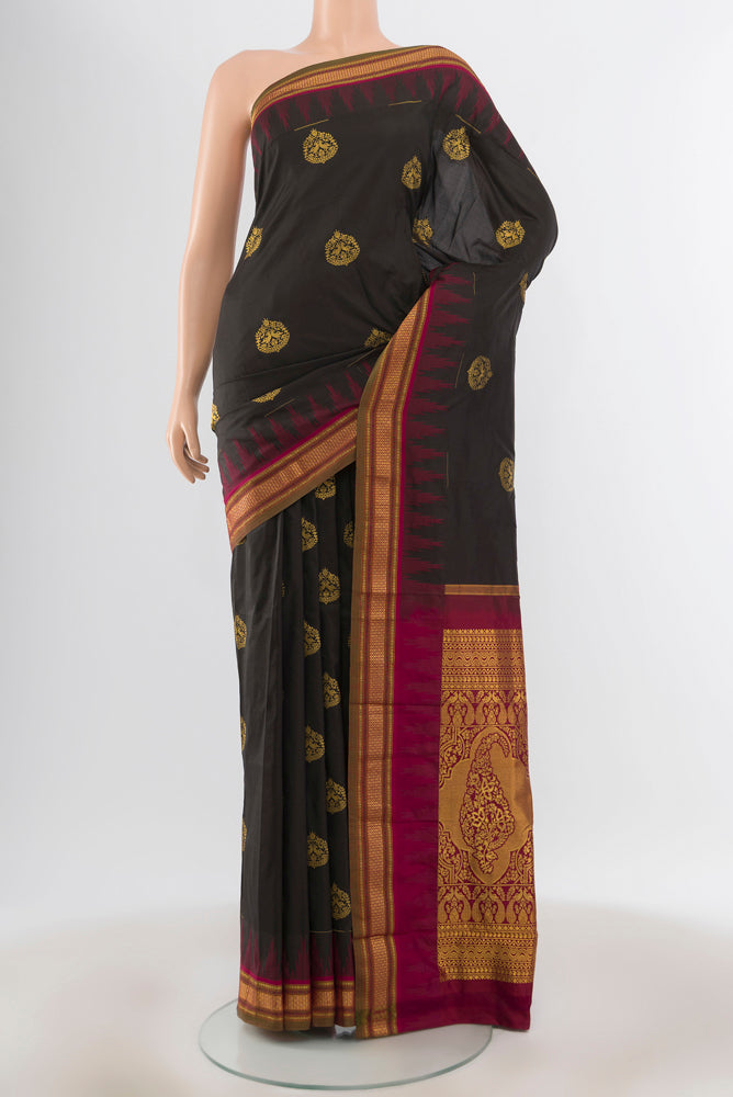 Pure Silk Pure Zari Black Bangalore - kadyal Saree with Zari Butta on the body and Silk Border.  displayed on a mannequin
