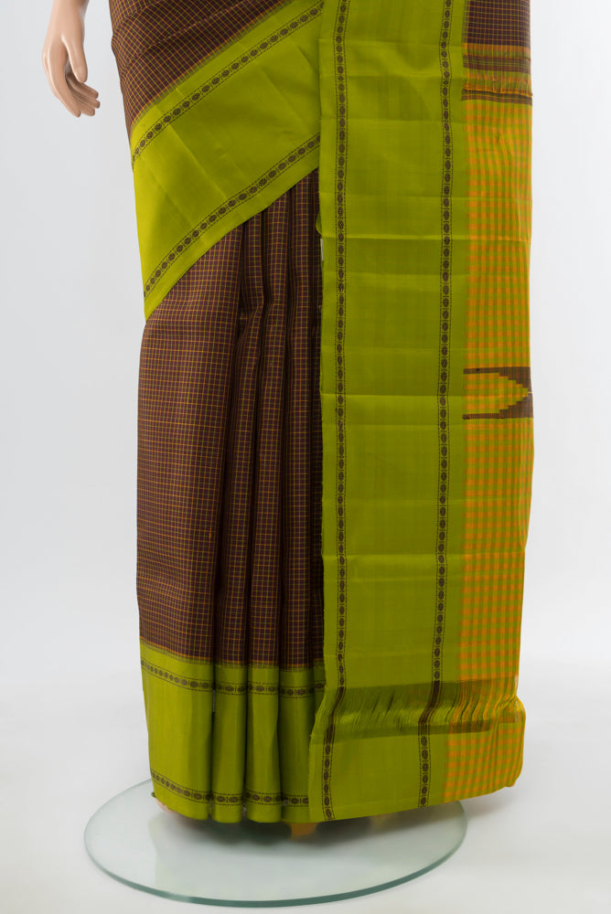 Pleats and pallu of Coffee Brown Kanchipuram Silk Saree with Zari Butta on the body and Silk Border. 