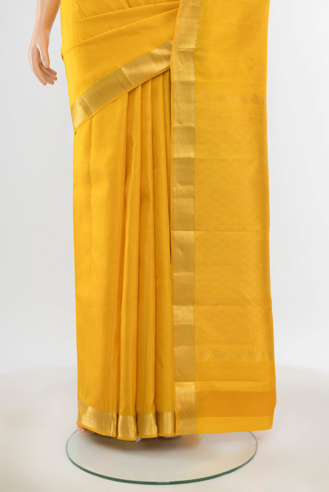 Pleats and pallu of Pure Silk Pure Zari Yellow Kanjivaram Saree with Zari Butta on the body and Silk Border. 