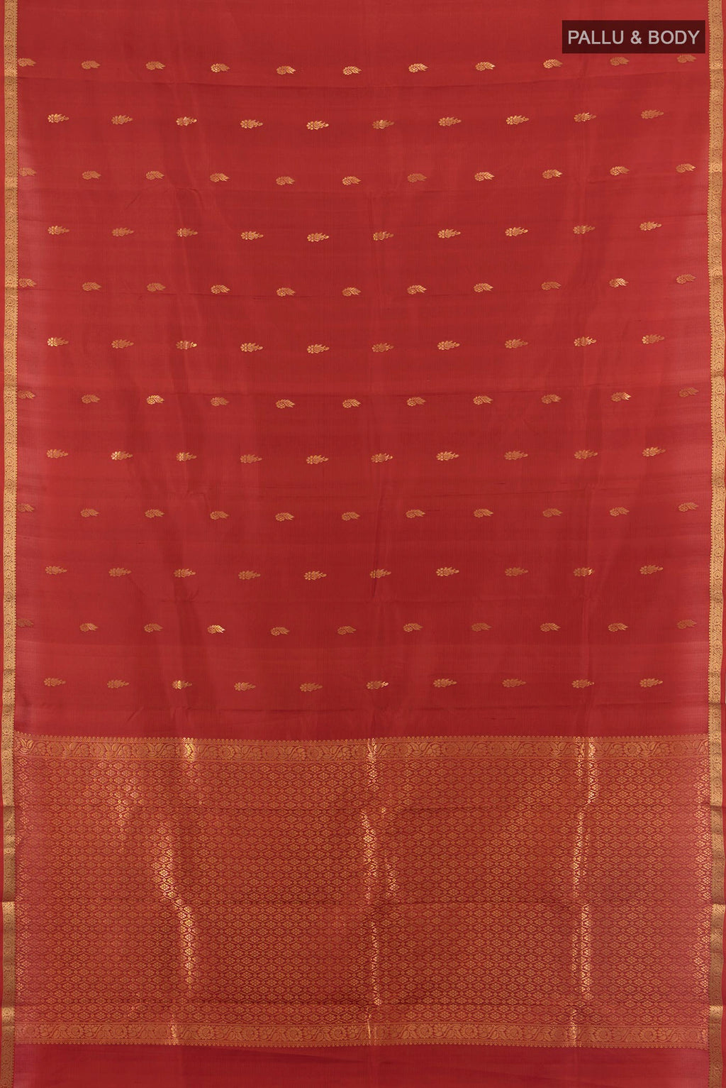 Flat view of Pure Silk Rust Kanjivaram Saree with Zari Butta on the body and Zari Border. 