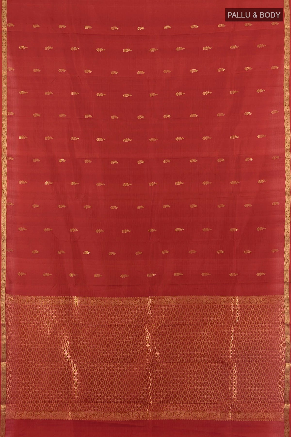 Flat view of Pure Silk Rust Kanjivaram Saree with Zari Butta on the body and Zari Border. 