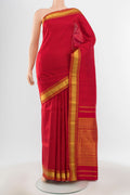 Pure Silk Pure Zari Maroon Kanjivaram Saree with Zari Butta on the body and Silk Border.  displayed on a mannequin