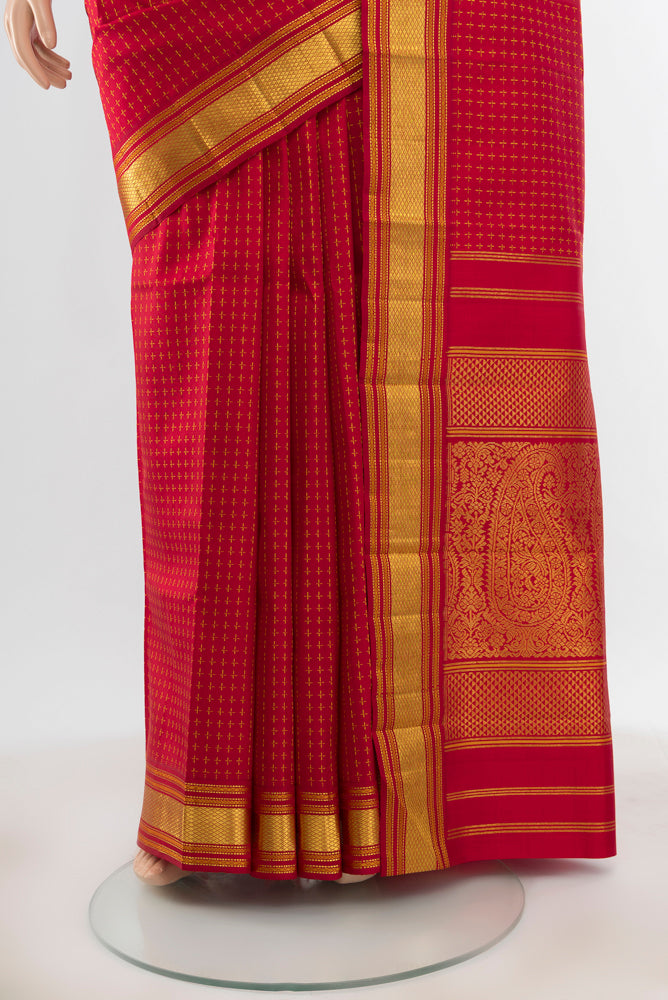 Pleats and pallu of Pure Silk Pure Zari Maroon Kanjivaram Saree with Zari Butta on the body and Silk Border. 