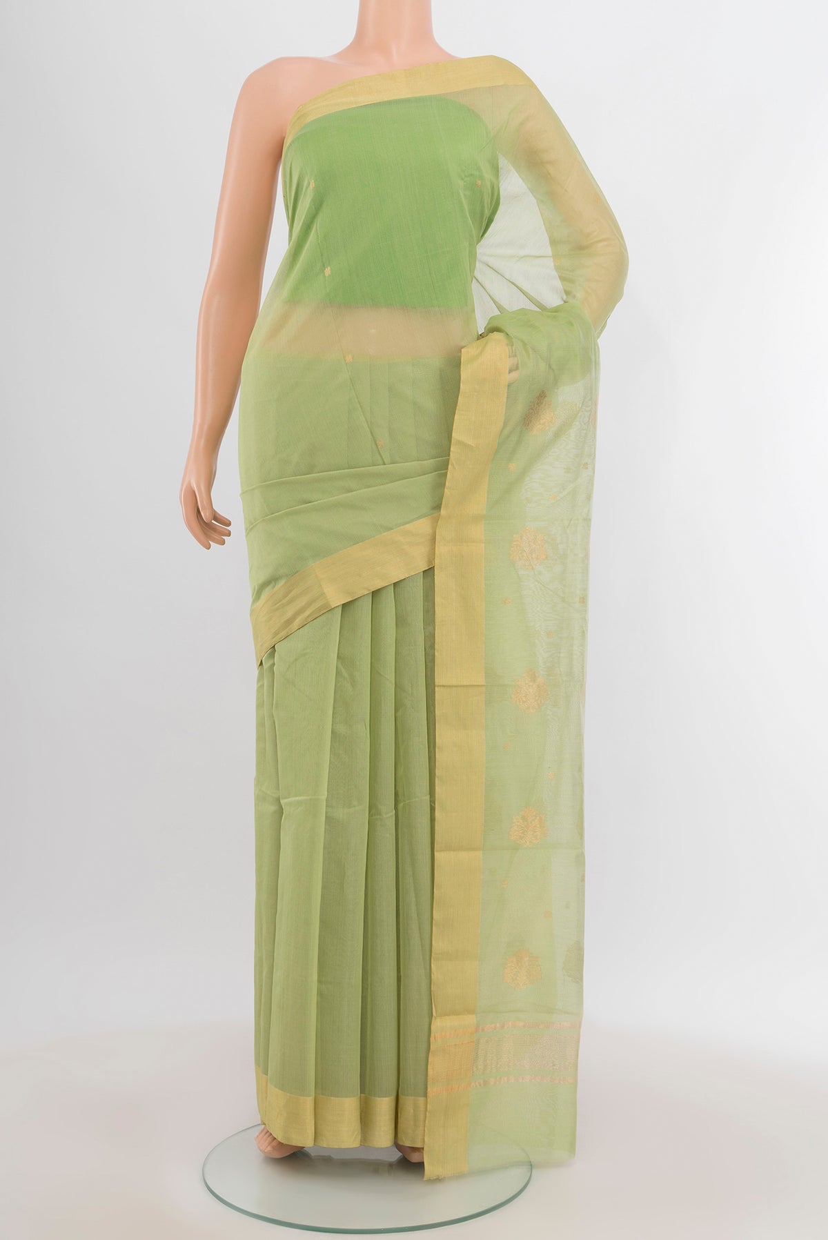 Pista Green Chanderi Silk Cotton Saree with Zari Butta on the body and Zari Border.  displayed on a mannequin