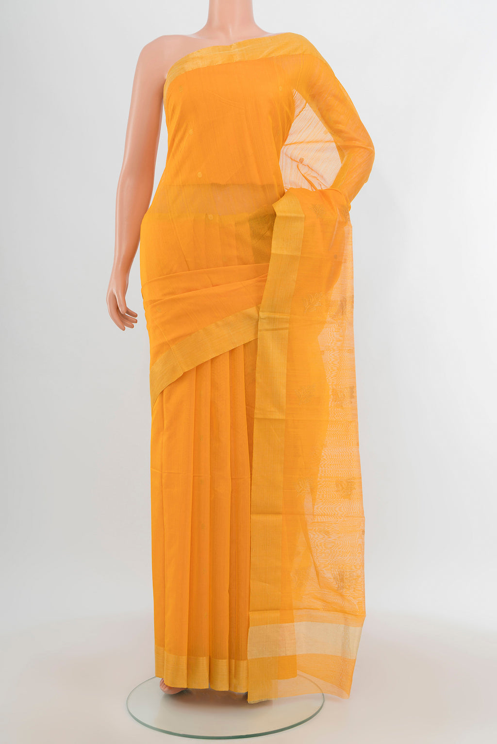 Orange Chanderi Silk Cotton Saree with Zari Butta on the body and Zari Border.  displayed on a mannequin