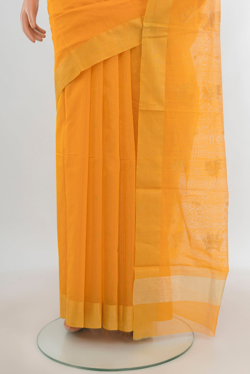 Pleats and pallu of Orange Chanderi Silk Cotton Saree with Zari Butta on the body and Zari Border. 