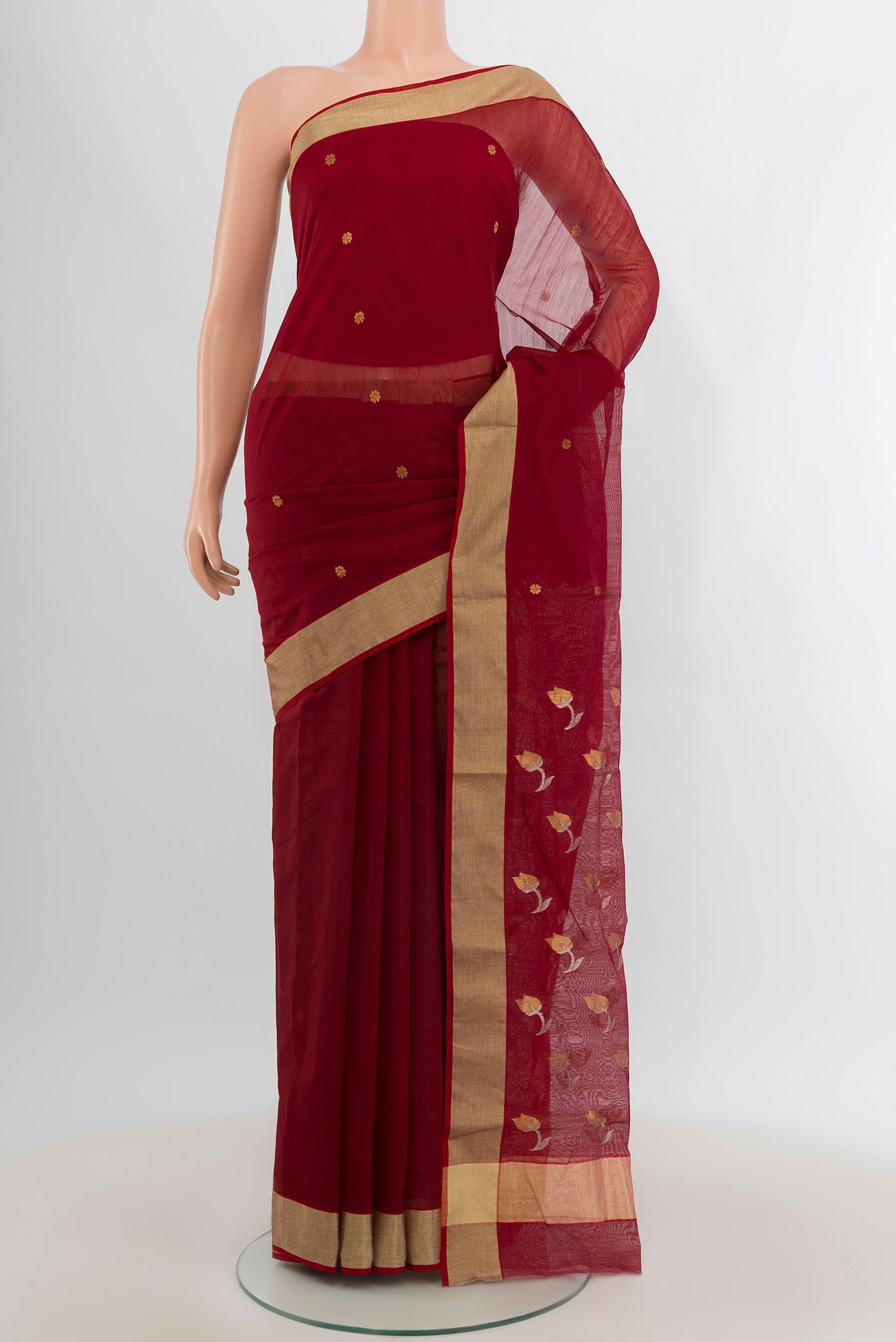 Maroon Chanderi Silk Cotton Saree with Zari Butta on the body and Zari Border.  displayed on a mannequin