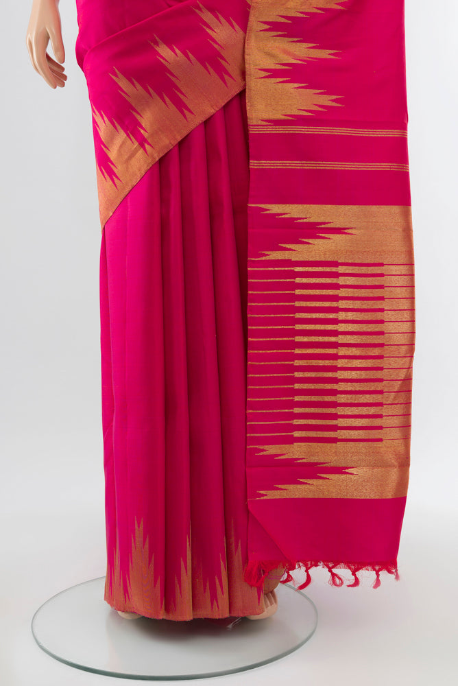 Pleats and pallu of Pure Silk Pure Zari Dark Pink Kanchipuram Saree with Zari Butta on the body and Silk Border. 