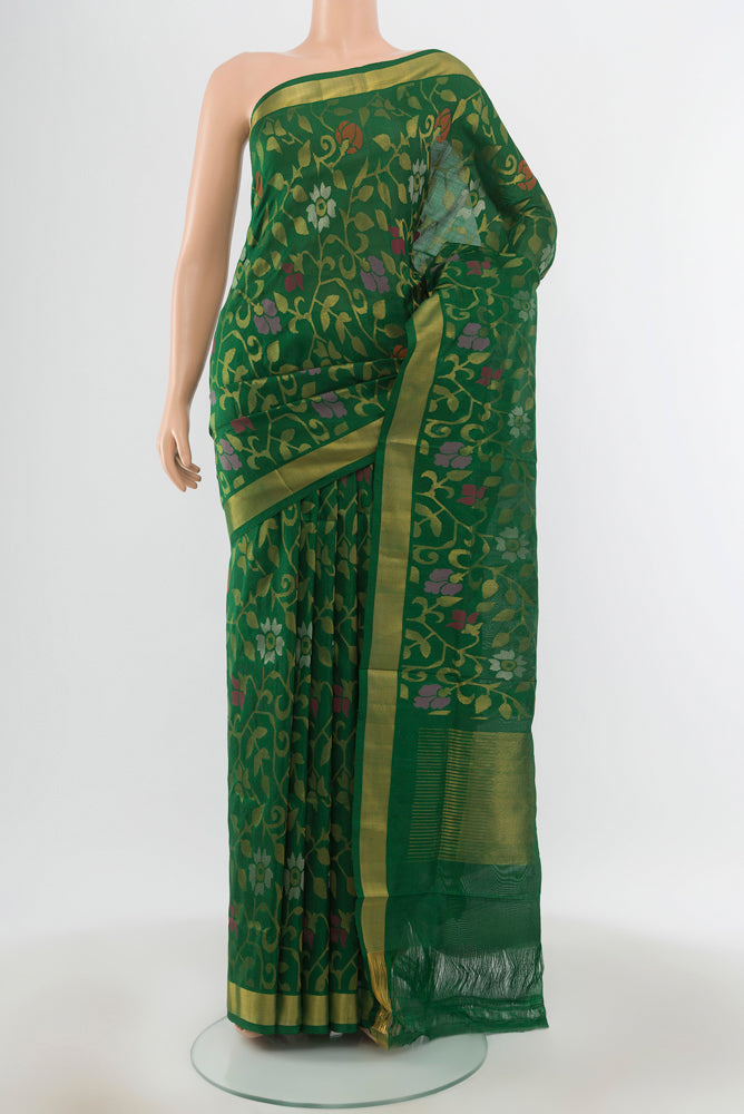 Bottle Green Uppada Silk Saree with Zari Butta on the body and Silk Border.  displayed on a mannequin