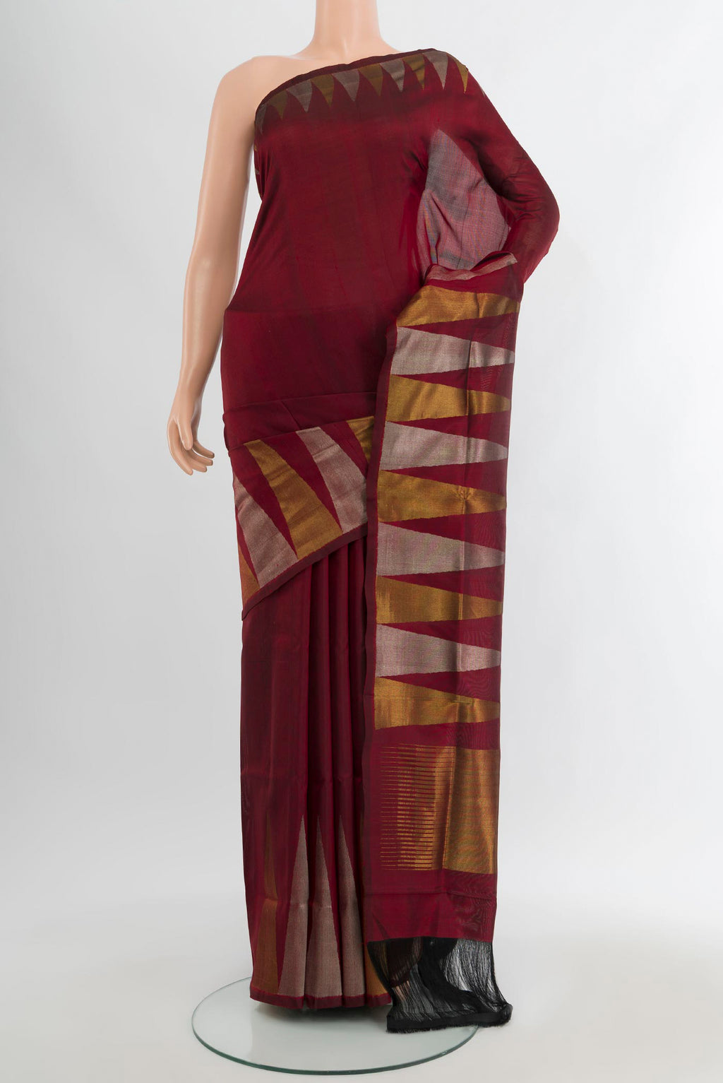 Maroon Uppada Silk Saree with Plain Body and Temple Border.  displayed on a mannequin