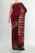 Maroon Uppada Silk Saree with Plain Body and Temple Border.  displayed on a mannequin