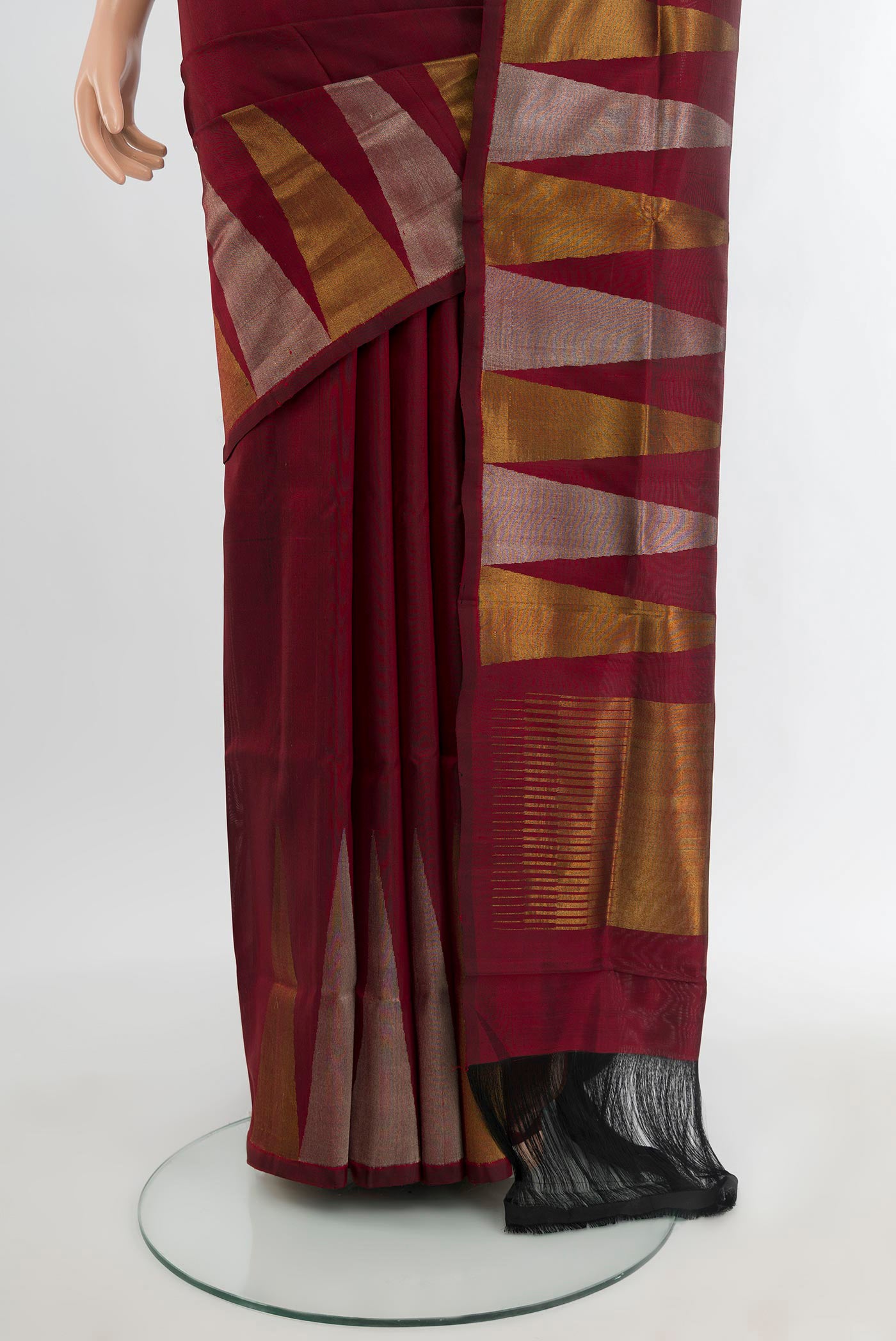 Pleats and pallu of Maroon Uppada Silk Saree with Plain Body and Temple Border. 