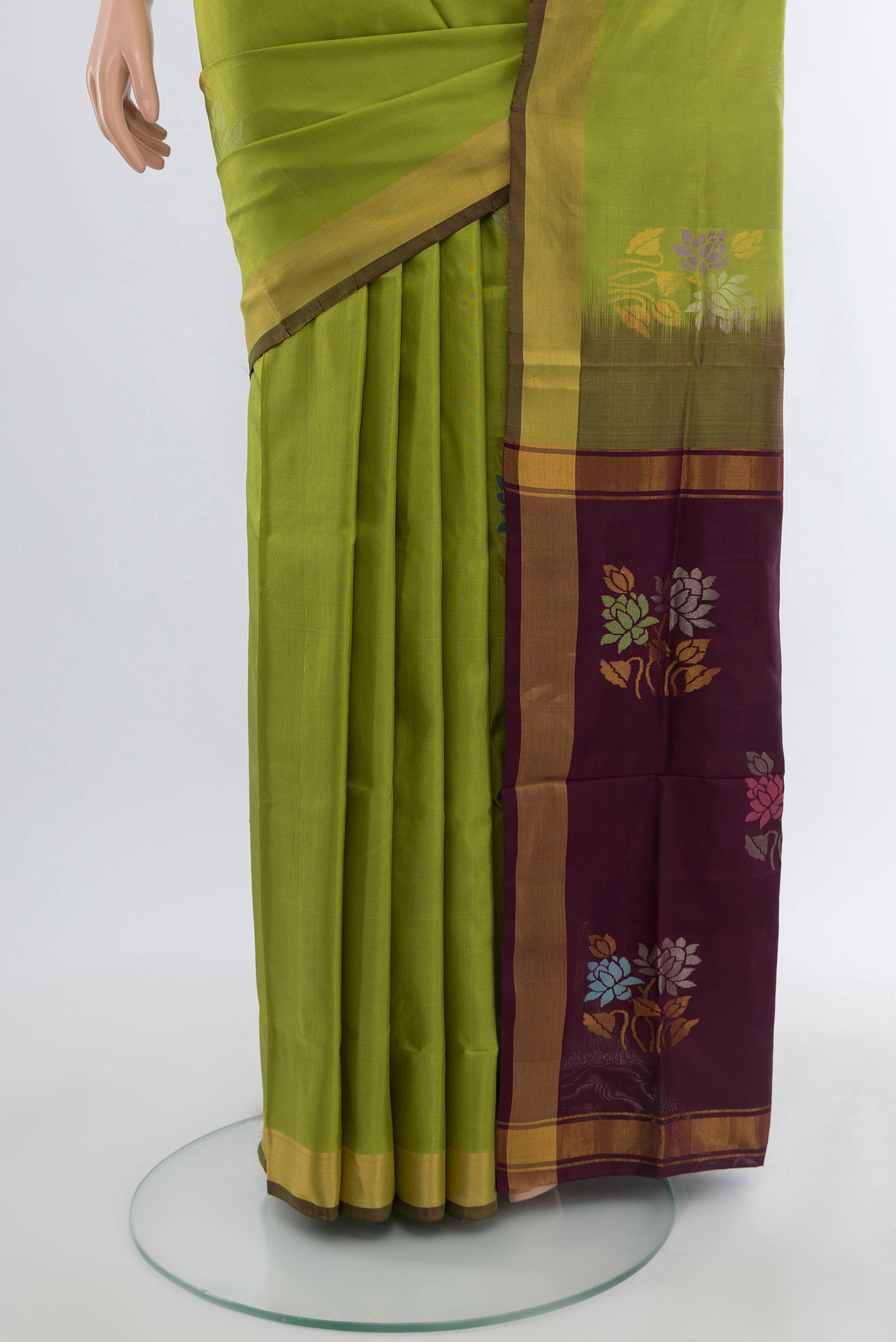 Pleats and pallu of Light Green Uppada Silk Saree with Zari Butta on the body and Silk Border. 