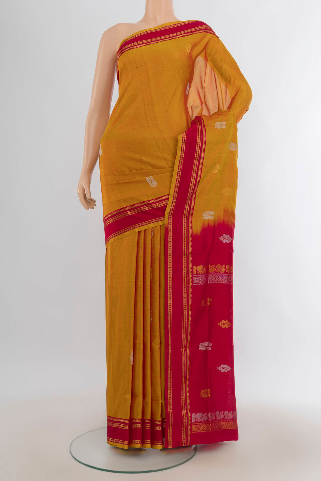 Pure Silk Mustard Uppada Saree with Zari Butta on the body and Silk Border.  displayed on a mannequin