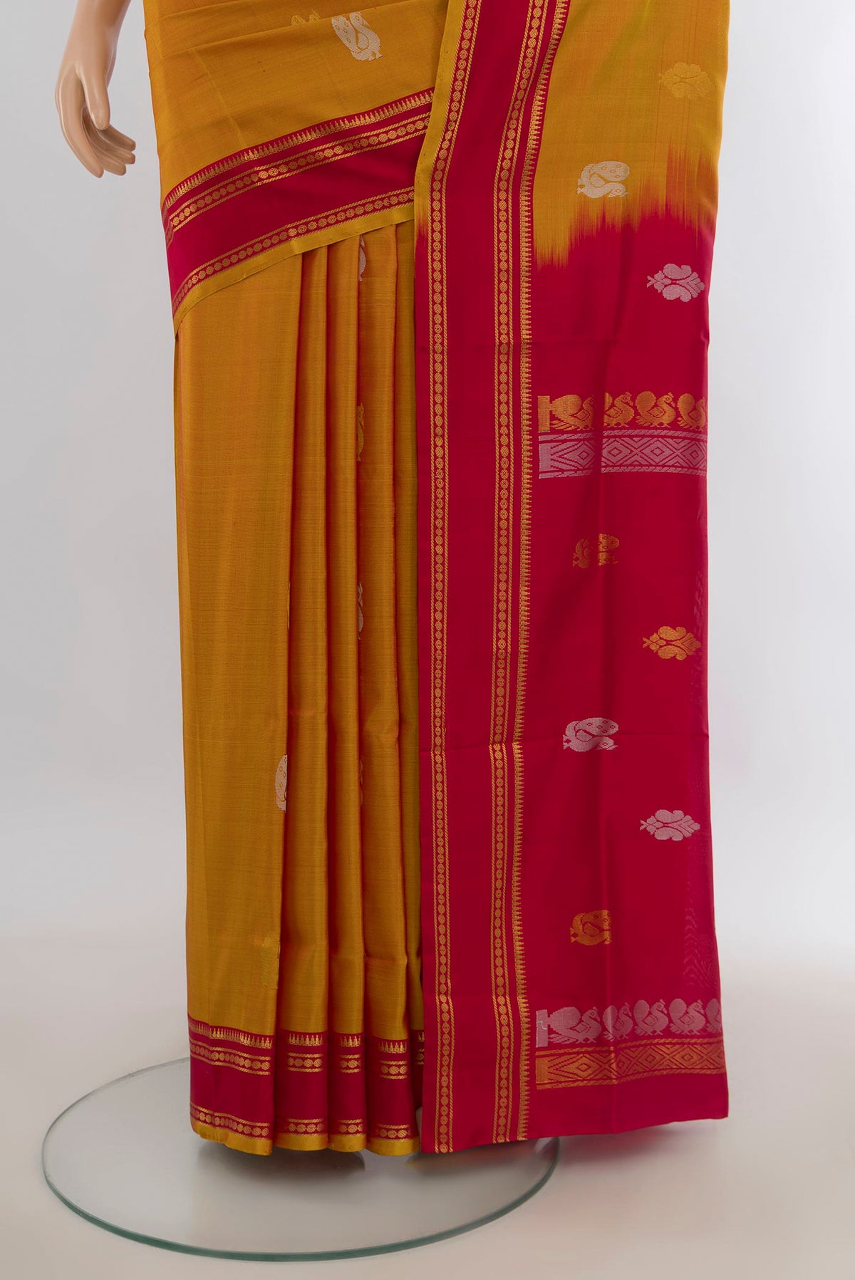 Pleats and pallu of Pure Silk Mustard Uppada Saree with Zari Butta on the body and Silk Border. 