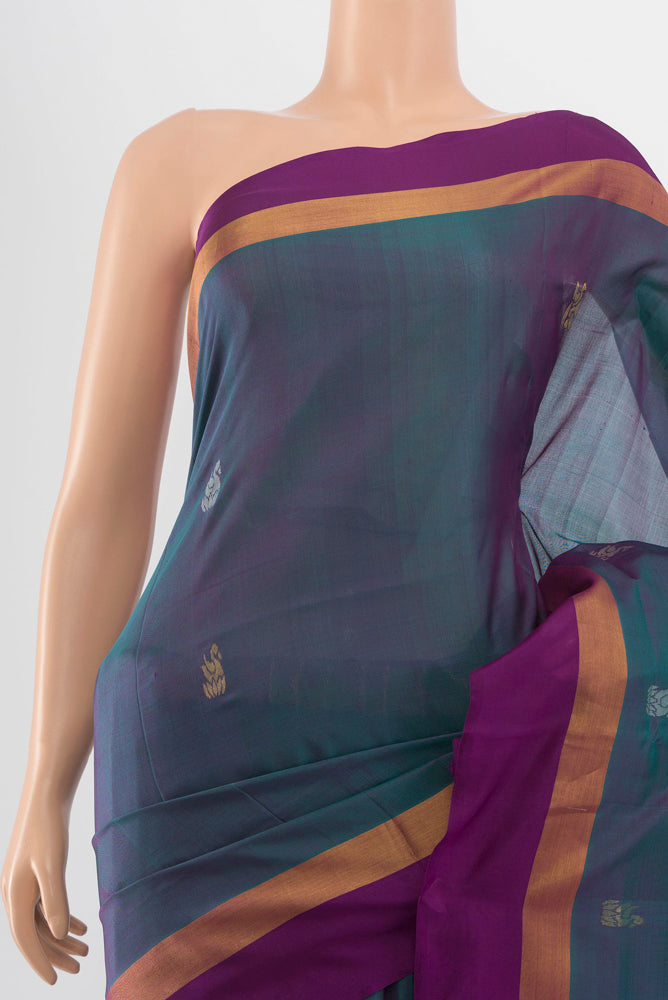 Border image of Peacock Blue Uppada Silk Saree with Zari Butta on the body and Silk Border. 