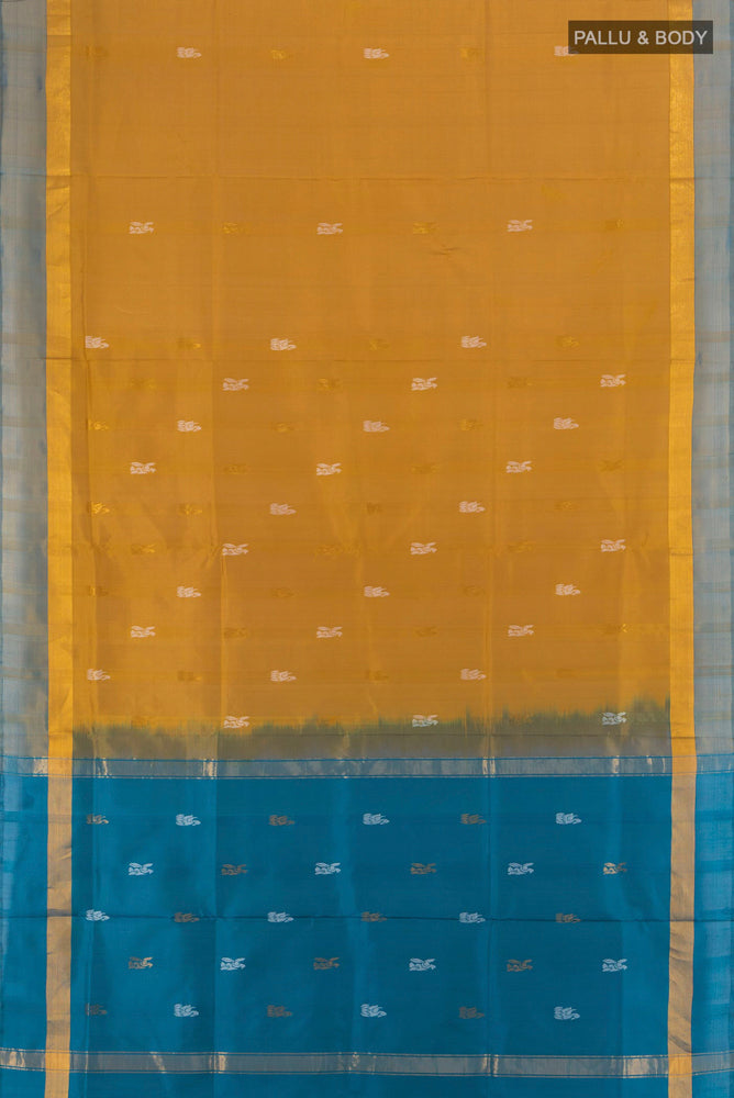 Flat view of Golden Uppada Silk Saree with Zari Butta on the body and Silk Border. 