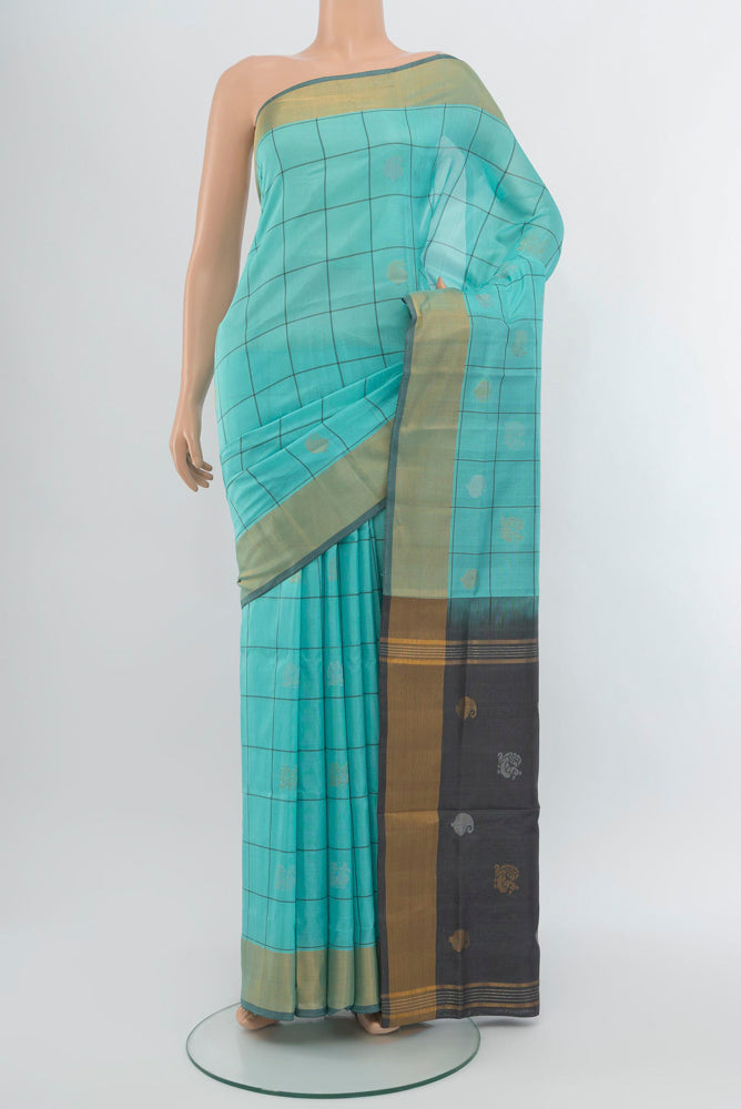 Sky Blue Uppada Silk Saree with Zari Butta on the body and Zari Border.  displayed on a mannequin