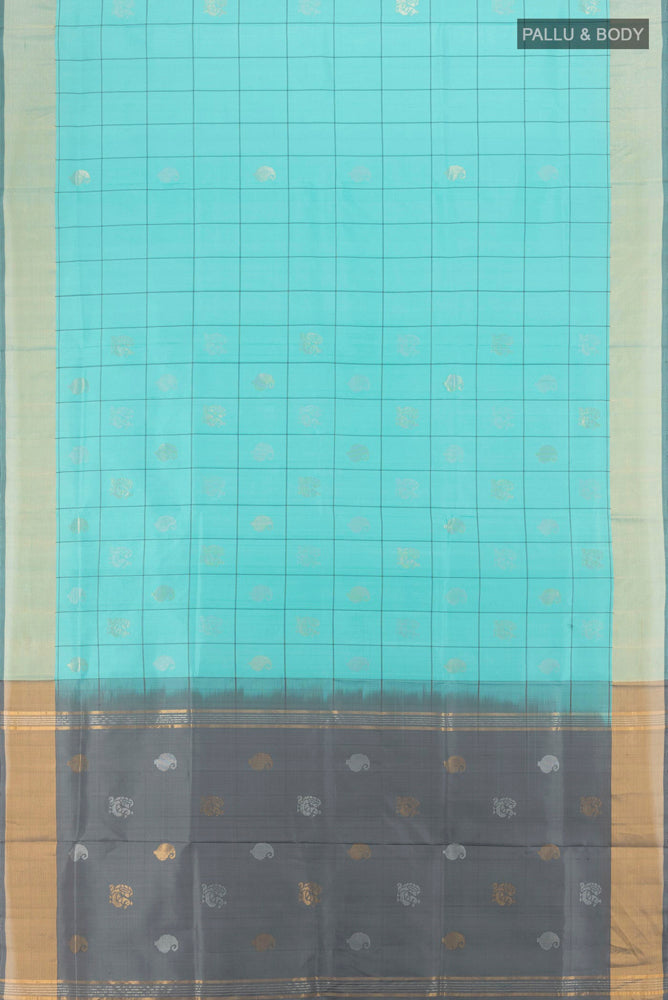 Flat view of Sky Blue Uppada Silk Saree with Zari Butta on the body and Zari Border. 