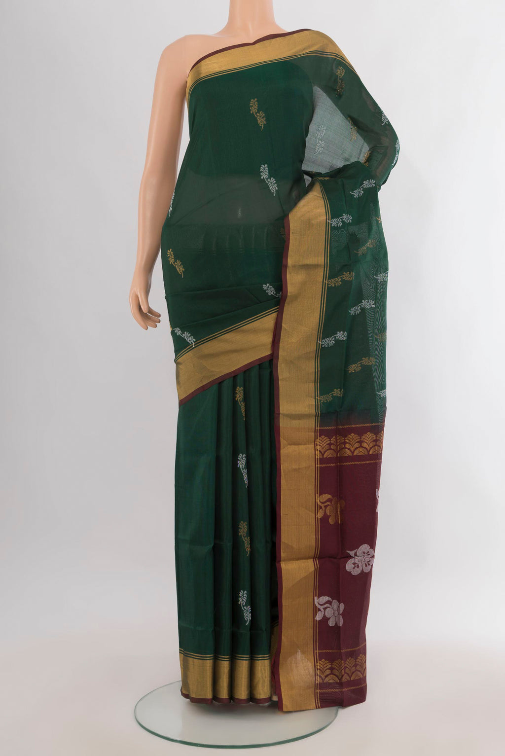 Pure Silk Bottle Green Uppada Saree with Zari Butta on the body and Zari Border.  displayed on a mannequin