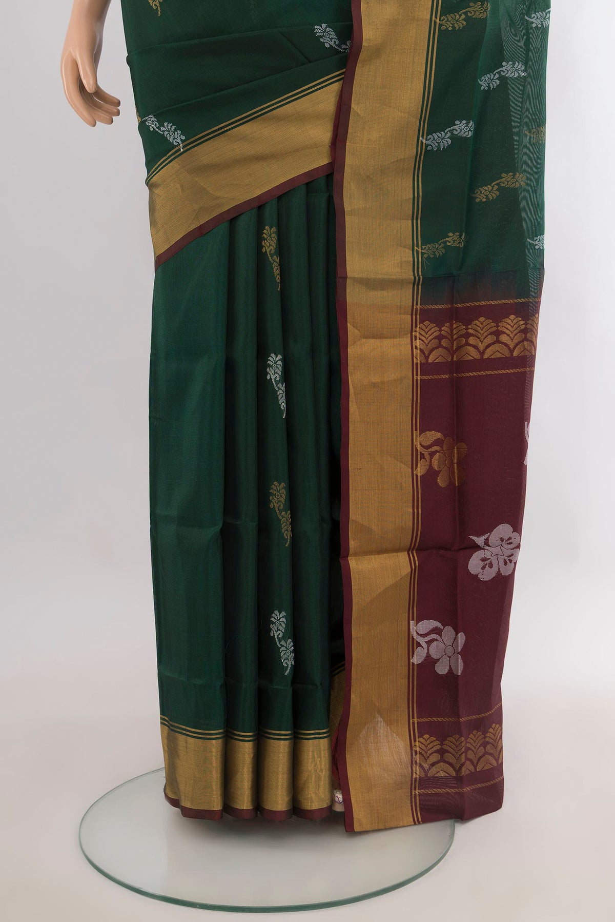 Pleats and pallu of Pure Silk Bottle Green Uppada Saree with Zari Butta on the body and Zari Border. 