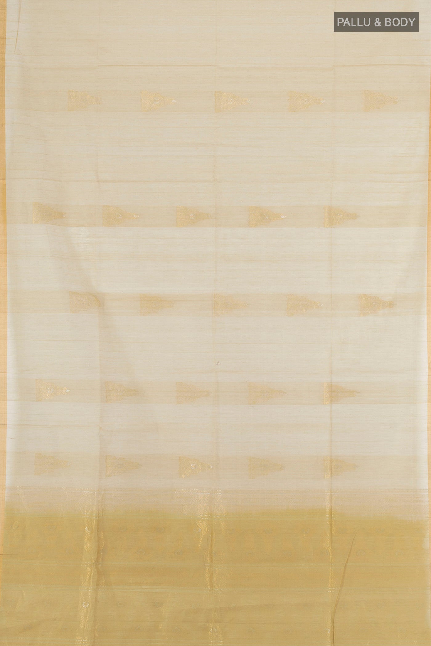 Flat view of Beige Silk Cotton Saree with Zari Butta on the body and Zari Border. 