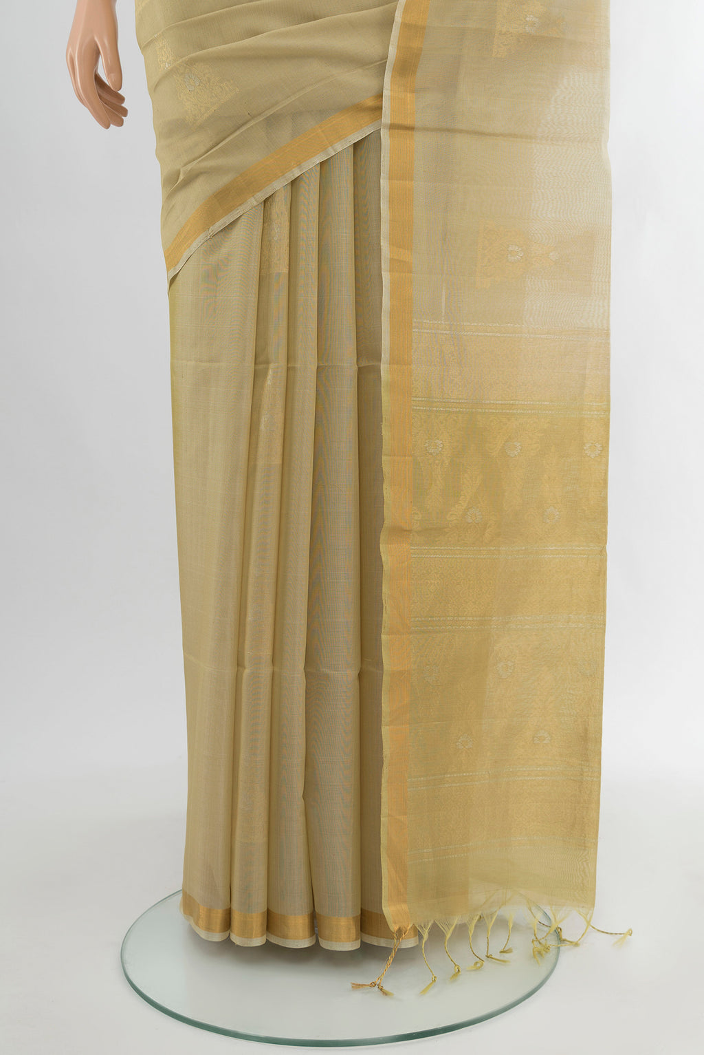 Pleats and pallu of Beige Silk Cotton Saree with Zari Butta on the body and Zari Border. 