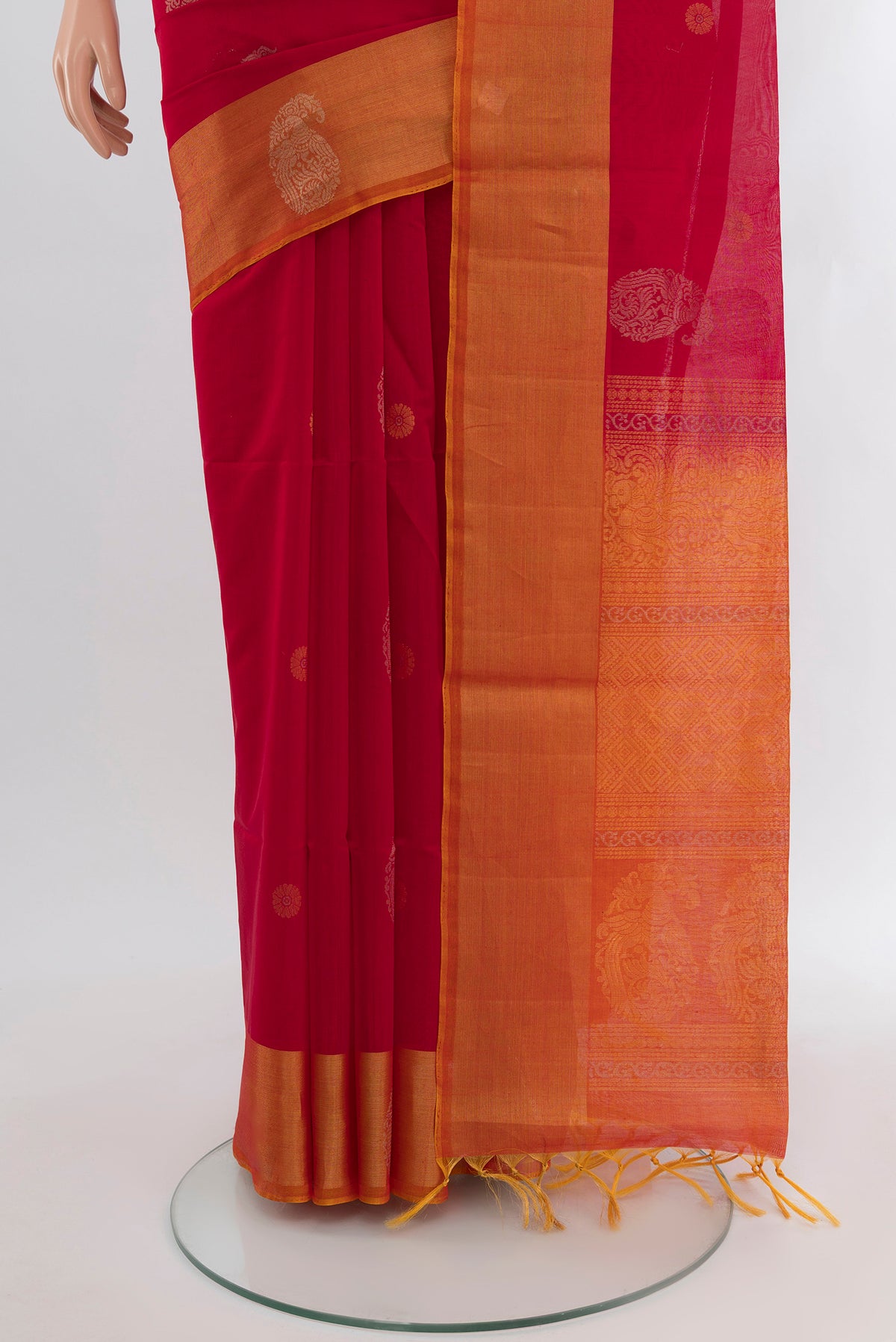 Pleats and pallu of Red Silk Cotton Saree with Zari Butta on the body and Zari Border. 