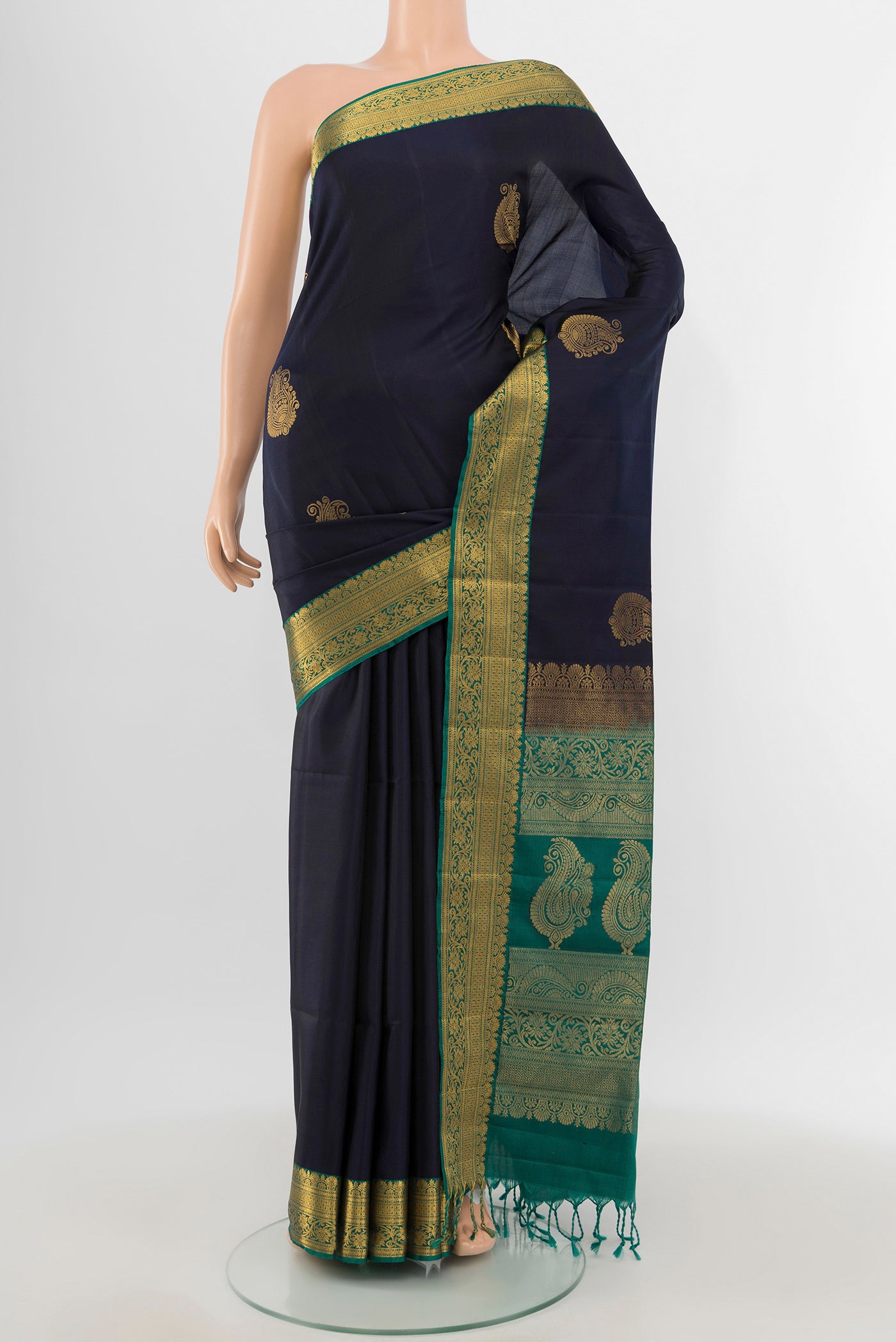 Navy Blue Soft Silk Saree with Zari Butta on the body and Zari Border.  displayed on a mannequin